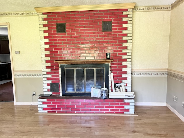 343 Lebanon Ave, Lebanon, CT 06249 - detailed view of a fireplace, wood finished floors, and baseboards