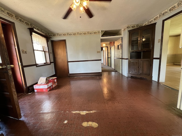 343 Lebanon Ave, Lebanon, CT 06249 - spare room featuring ceiling fan, a textured ceiling, and wainscoting
