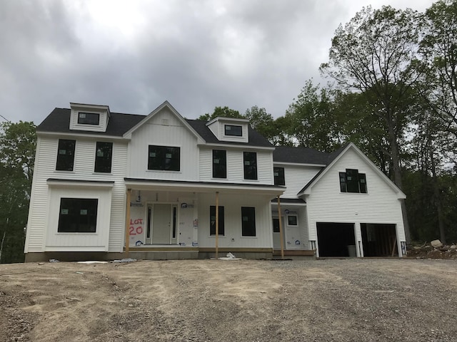 31 Jerome Ave, Burlington, CT 06013 - modern inspired farmhouse featuring covered porch, a garage, and gravel driveway