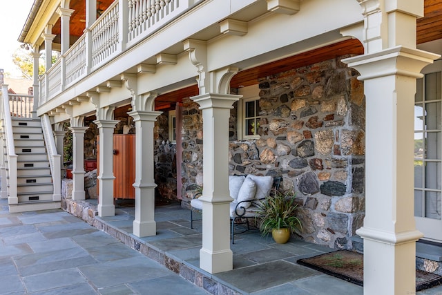 55 Lake Dr S, New Fairfield, CT 06812 - doorway to property with covered porch, stone siding, and a balcony