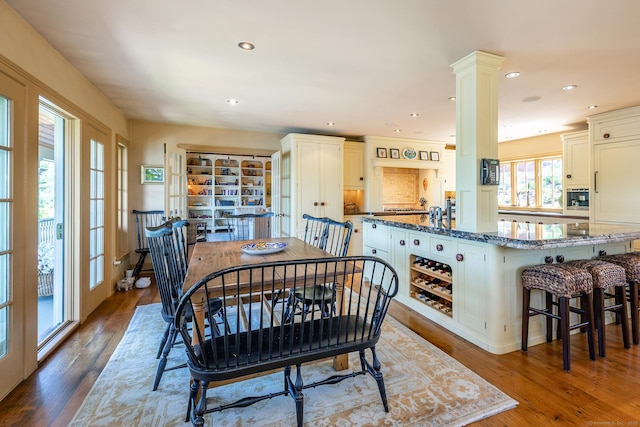 55 Lake Dr S, New Fairfield, CT 06812 - dining area featuring recessed lighting, wood finished floors, and ornate columns