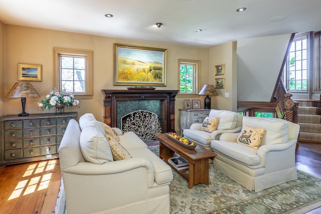 55 Lake Dr S, New Fairfield, CT 06812 - living room with healthy amount of natural light, wood finished floors, a high end fireplace, and recessed lighting