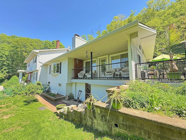 5 Yochers Ln, Derby, CT 06418 - back of house with a chimney and a yard
