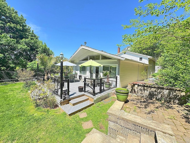 5 Yochers Ln, Derby, CT 06418 - back of property with a wooden deck, a yard, and outdoor dining area