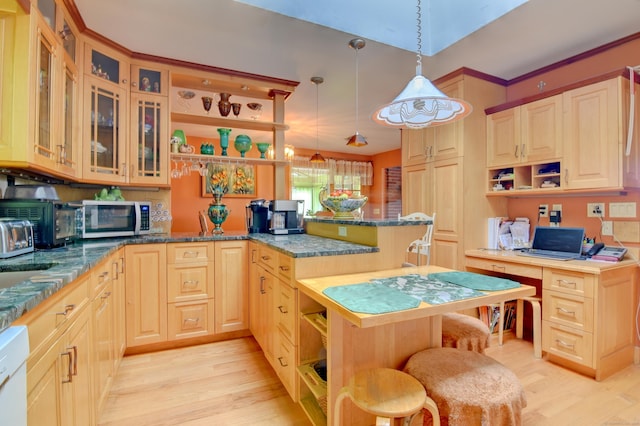 5 Yochers Ln, Derby, CT 06418 - kitchen with open shelves, stainless steel microwave, a peninsula, light wood-type flooring, and a kitchen bar