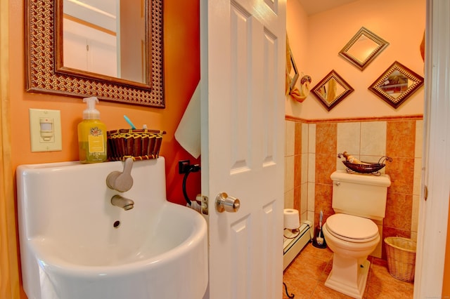 5 Yochers Ln, Derby, CT 06418 - bathroom featuring baseboard heating, tile patterned flooring, tile walls, toilet, and a wainscoted wall