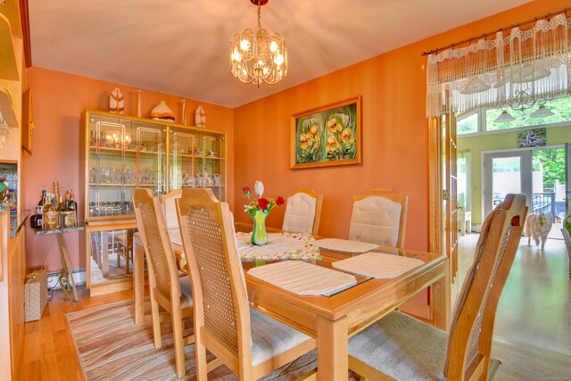 5 Yochers Ln, Derby, CT 06418 - dining space featuring wood finished floors, a chandelier, and baseboard heating