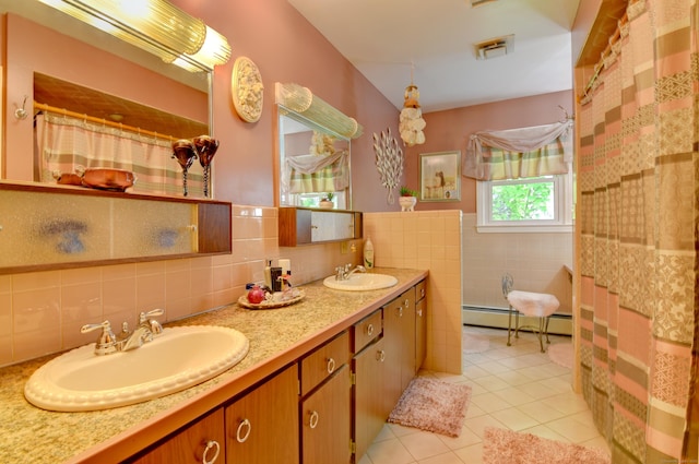 5 Yochers Ln, Derby, CT 06418 - full bath with tile walls, tile patterned floors, baseboard heating, double vanity, and wainscoting