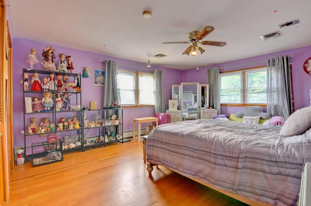 5 Yochers Ln, Derby, CT 06418 - bedroom with baseboard heating, multiple windows, wood finished floors, and ceiling fan