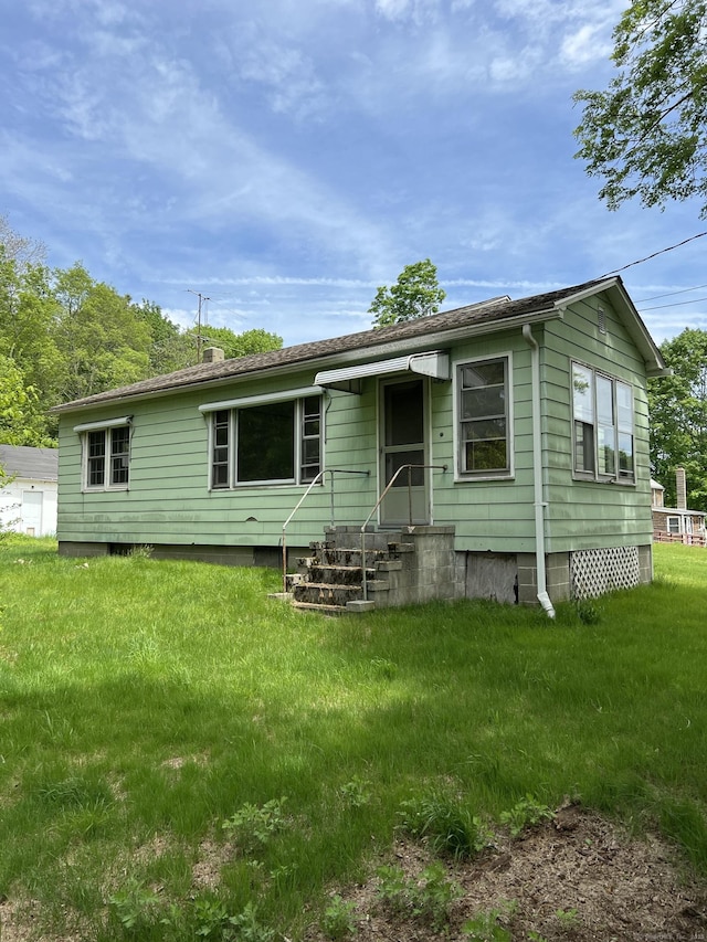 1092 Plainfield Pike, Sterling, CT 06373 - rear view of property featuring a yard