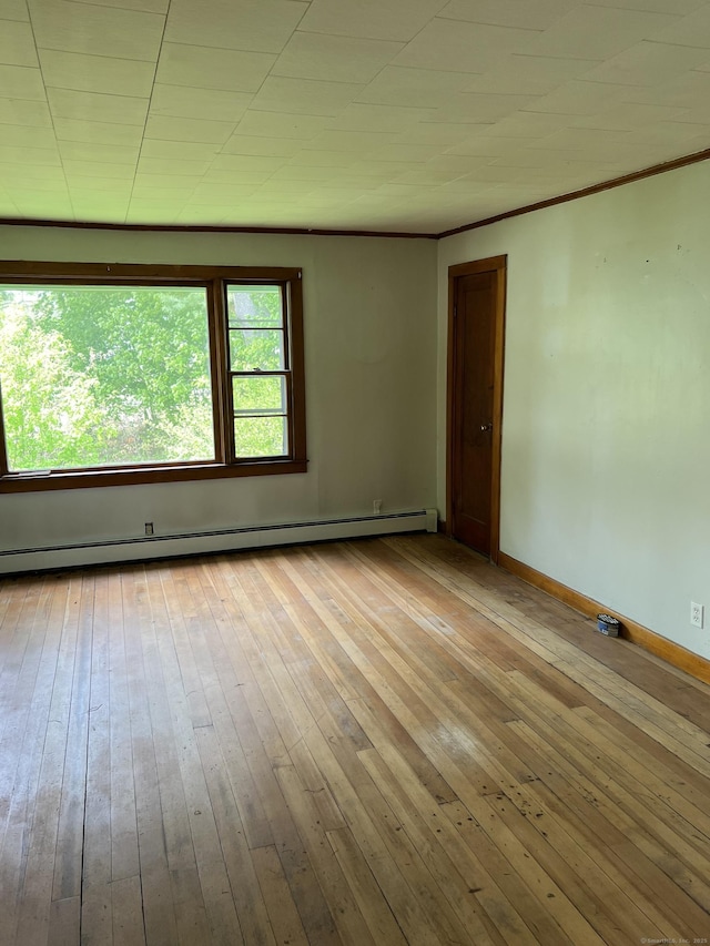 1092 Plainfield Pike, Sterling, CT 06373 - spare room featuring hardwood / wood-style floors, baseboards, a baseboard radiator, and ornamental molding
