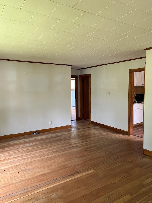 1092 Plainfield Pike, Sterling, CT 06373 - unfurnished room with ornamental molding, hardwood / wood-style flooring, and baseboards