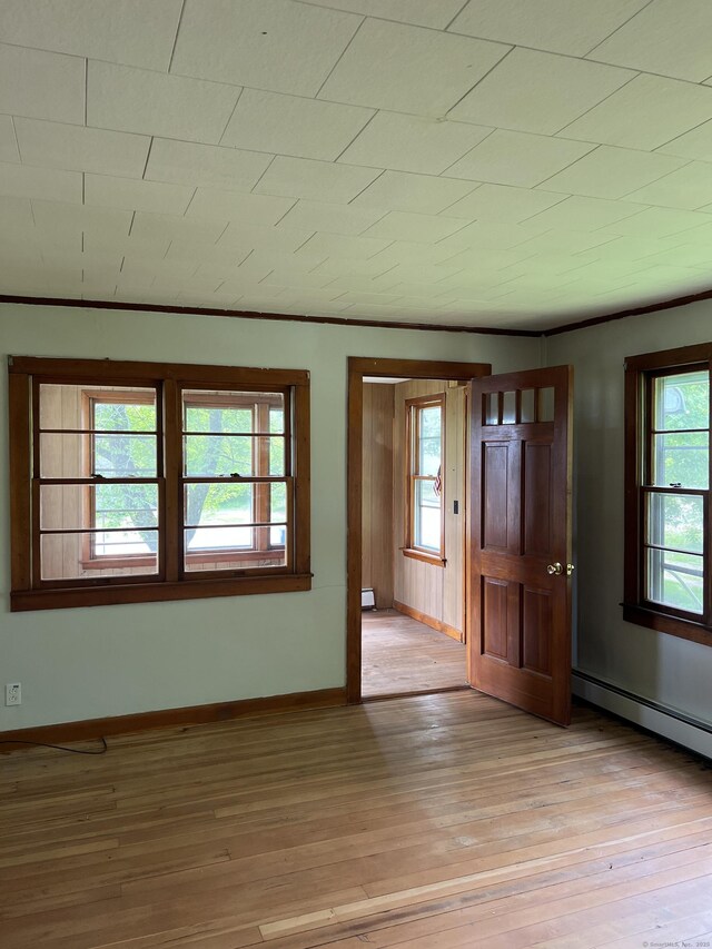 1092 Plainfield Pike, Sterling, CT 06373 - foyer entrance with light wood finished floors, baseboards, a baseboard radiator, and crown molding