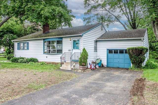 1 Triangle Ter, Danbury, CT 06810 - ranch-style house featuring a chimney, a garage, and asphalt driveway