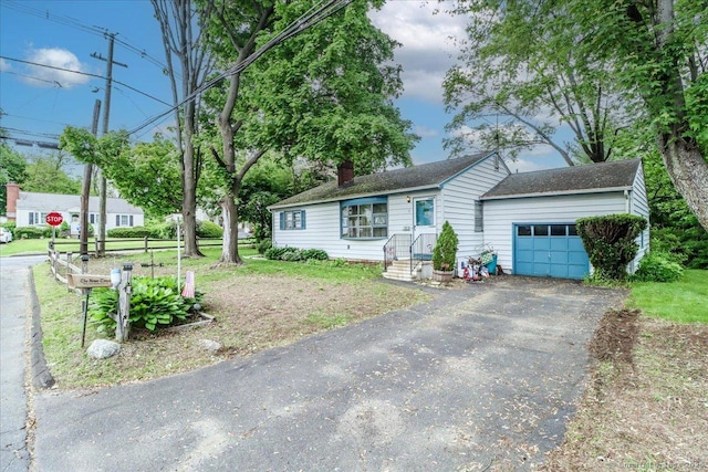 1 Triangle Ter, Danbury, CT 06810 - ranch-style home featuring an attached garage, a chimney, and driveway
