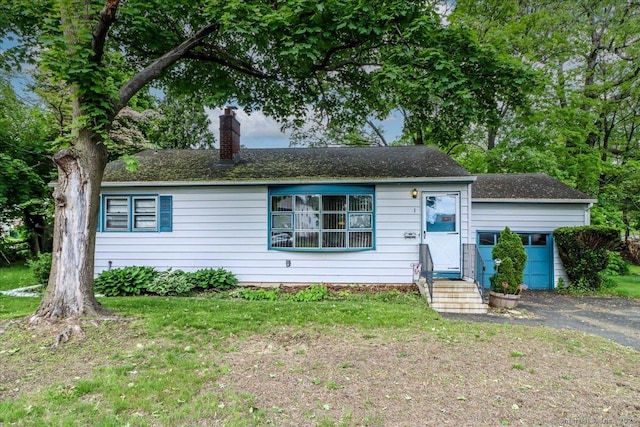 1 Triangle Ter, Danbury, CT 06810 - view of front of house with a chimney, entry steps, and a front yard