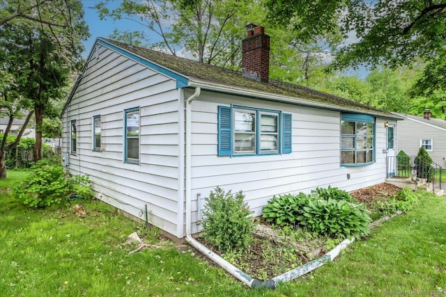 1 Triangle Ter, Danbury, CT 06810 - view of property exterior featuring a chimney and a lawn