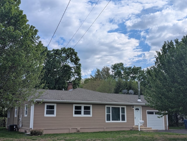 9 Washington Rd, Windsor, CT 06095 - view of front of home with a chimney and central AC