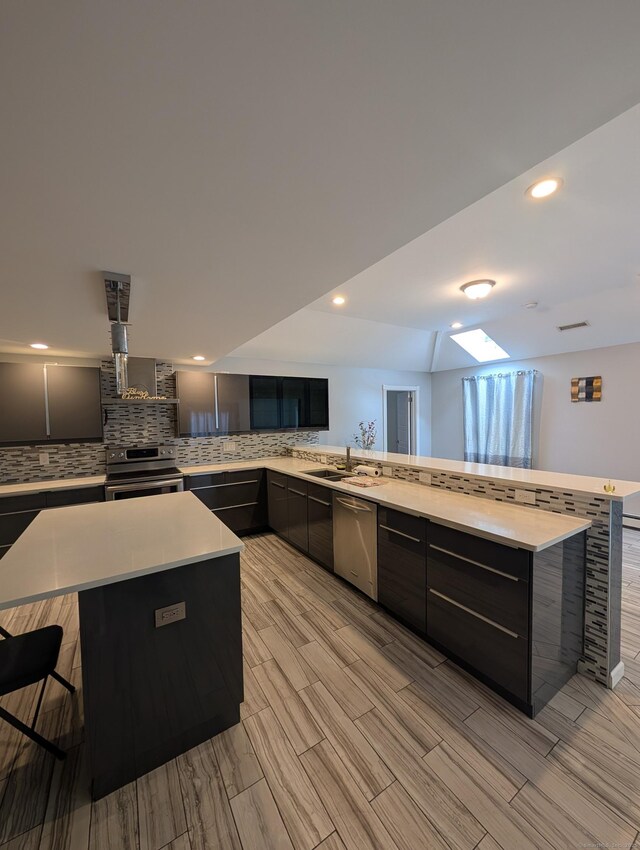 9 Washington Rd, Windsor, CT 06095 - kitchen featuring stainless steel appliances, modern cabinets, tasteful backsplash, and recessed lighting