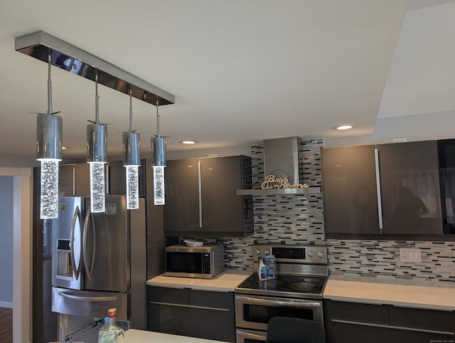 kitchen with stainless steel appliances, light countertops, backsplash, modern cabinets, and recessed lighting