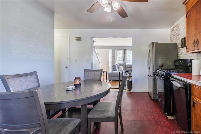 dining area featuring a ceiling fan, dark wood-style flooring, and baseboards