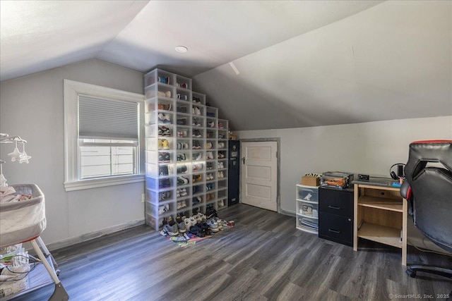 office featuring wood finished floors, lofted ceiling, and baseboards