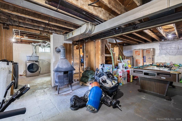 below grade area with washer / clothes dryer, billiards, and concrete block wall