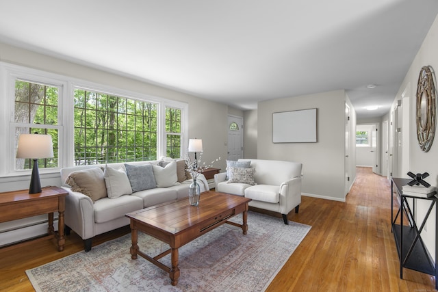 27 Scudder Rd, Newtown, CT 06470 - living area featuring light wood-style flooring, baseboard heating, and baseboards
