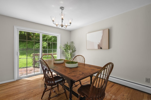 27 Scudder Rd, Newtown, CT 06470 - dining space with a chandelier, wood finished floors, and baseboards