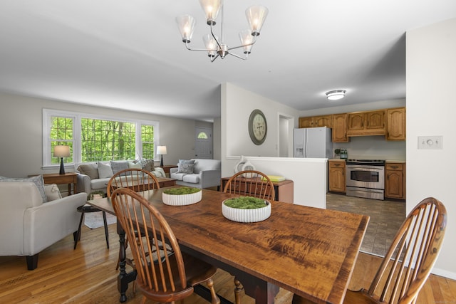 27 Scudder Rd, Newtown, CT 06470 - dining room featuring a chandelier and wood finished floors