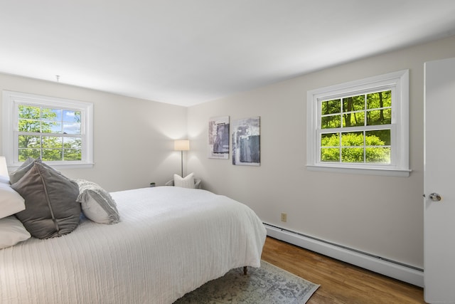 27 Scudder Rd, Newtown, CT 06470 - bedroom featuring a baseboard radiator and wood finished floors