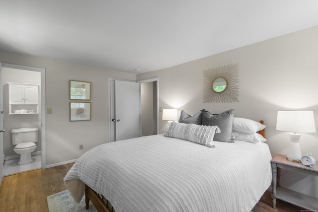 27 Scudder Rd, Newtown, CT 06470 - bedroom featuring wood finished floors, baseboards, and connected bathroom