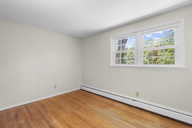 27 Scudder Rd, Newtown, CT 06470 - unfurnished room featuring a baseboard radiator, hardwood / wood-style floors, and baseboards