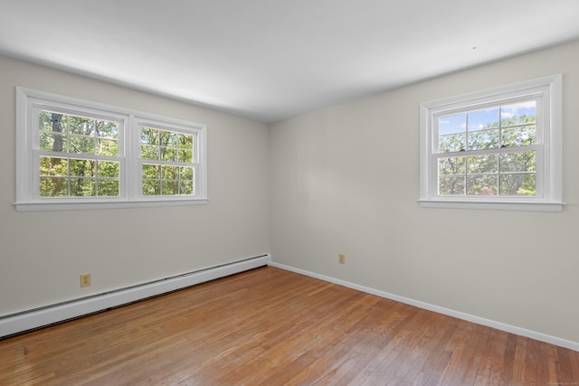 27 Scudder Rd, Newtown, CT 06470 - spare room featuring a baseboard radiator, light wood finished floors, and baseboards
