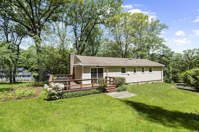 27 Scudder Rd, Newtown, CT 06470 - rear view of house featuring a deck, a chimney, and a yard