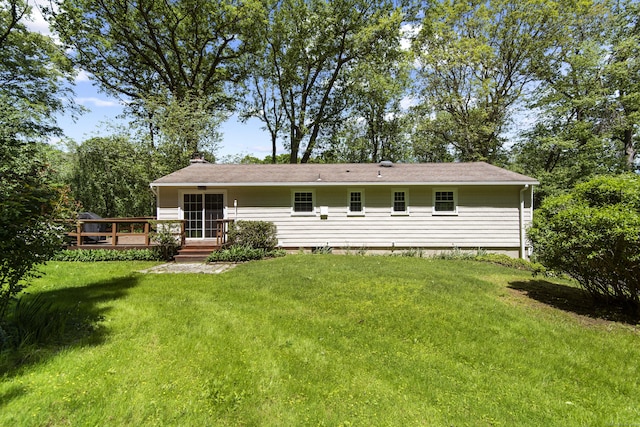 27 Scudder Rd, Newtown, CT 06470 - rear view of house with a chimney, a lawn, and a deck