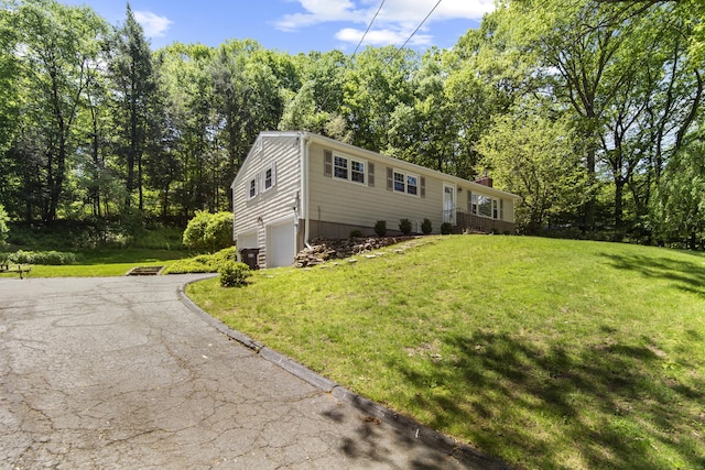 27 Scudder Rd, Newtown, CT 06470 - view of front of property featuring an attached garage, driveway, a front yard, and a chimney