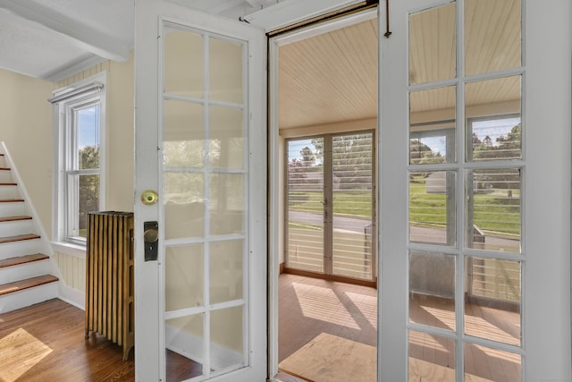 55 Dividend Rd, Rocky Hill, CT 06067 - doorway to outside featuring wood finished floors and stairway