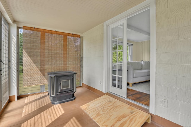55 Dividend Rd, Rocky Hill, CT 06067 - unfurnished sunroom featuring a wood stove