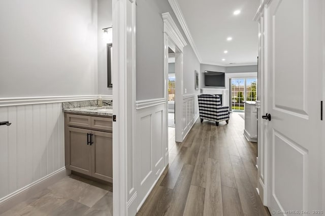 210 Munson Rd Unit 3-C, Wolcott, CT 06716 - corridor featuring a decorative wall, ornamental molding, wainscoting, wood finished floors, and recessed lighting
