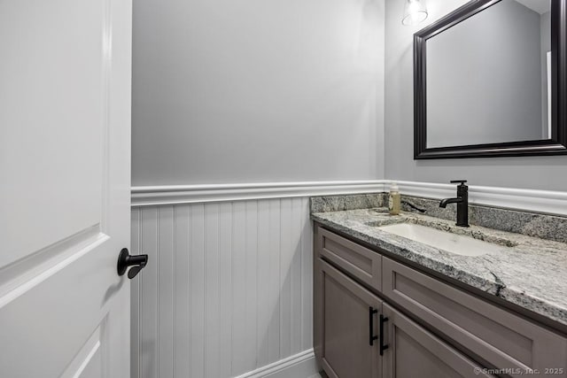 210 Munson Rd Unit 3-C, Wolcott, CT 06716 - bathroom with vanity, wainscoting, and a decorative wall