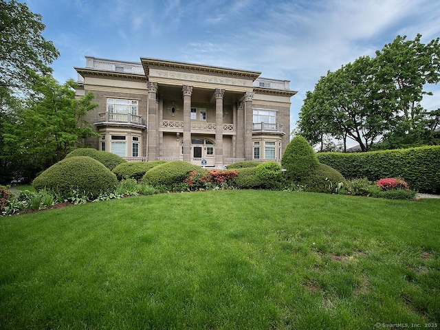 500 Prospect St Apt 3G, New Haven, CT 06511 - back of house with stone siding, a yard, and a balcony