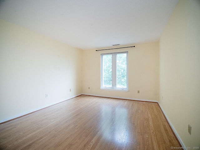 500 Prospect St Apt 3G, New Haven, CT 06511 - unfurnished room featuring wood finished floors and baseboards