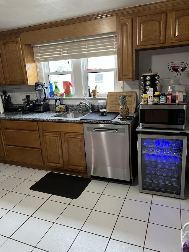 15 Michael Ave, East Hartford, CT 06111 - kitchen featuring stainless steel appliances, a sink, wine cooler, dark countertops, and healthy amount of natural light