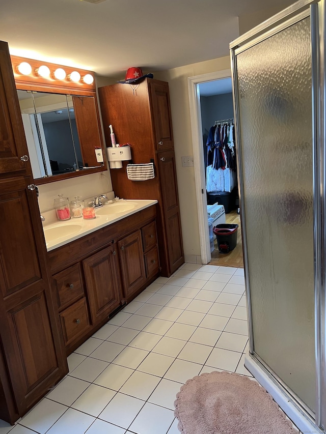 15 Michael Ave, East Hartford, CT 06111 - bathroom featuring a shower stall, tile patterned floors, double vanity, and a closet