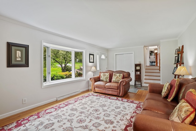 living room featuring a baseboard radiator, ornamental molding, stairway, wood finished floors, and baseboards