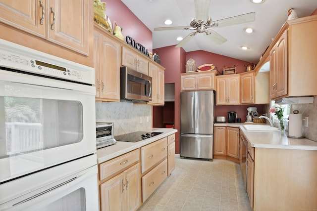kitchen with stainless steel appliances, light brown cabinetry, light countertops, tasteful backsplash, and ceiling fan