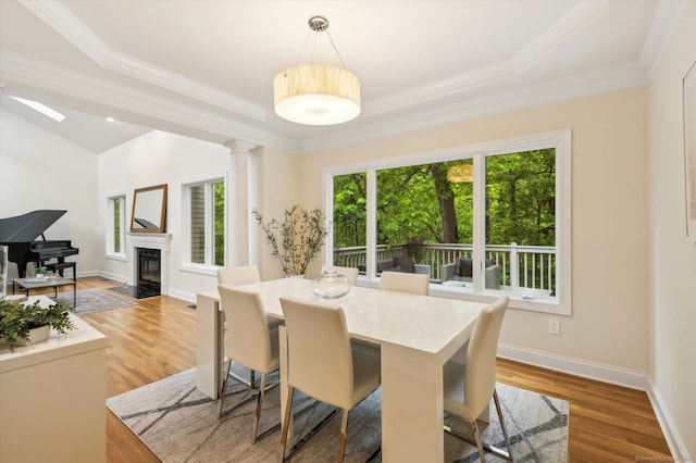 39 Gatewood Unit 39, Avon, CT 06001 - dining area with light wood-style floors, a fireplace with flush hearth, crown molding, and baseboards