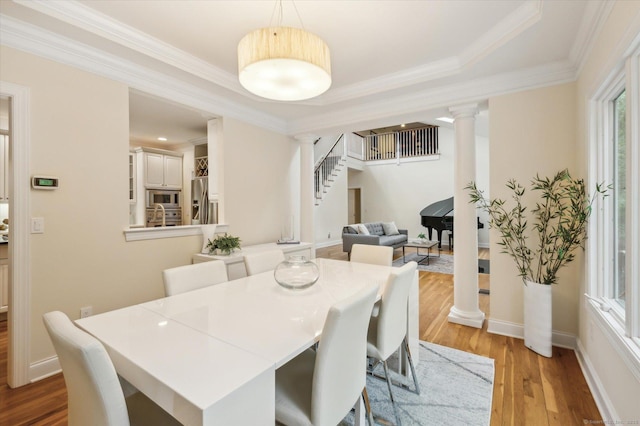 39 Gatewood Unit 39, Avon, CT 06001 - dining area featuring ornate columns, stairway, light wood-type flooring, and ornamental molding