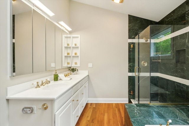 39 Gatewood Unit 39, Avon, CT 06001 - full bath with double vanity, wood finished floors, a shower stall, and baseboards